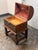 Design Plus Gallery presents an Antique Spanish Baroque Oak Trunk + Stand. The domed lid and rectangular body are...