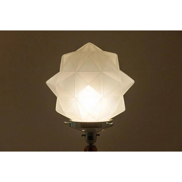 Original Art Deco Table Lamp. The column is made with deep amber glass globes on a chrome base, the bulb holder is...