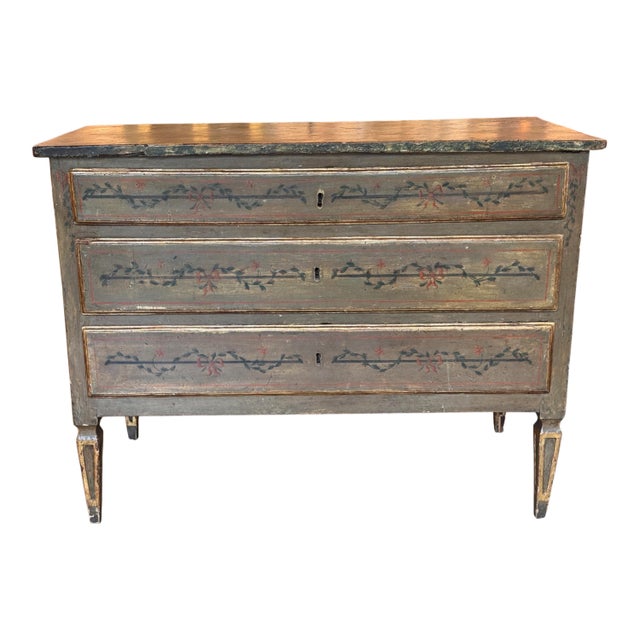 Italian neoclassical paint decorated chest of three long drawers, the case painted in soft green with faux marble top, the...