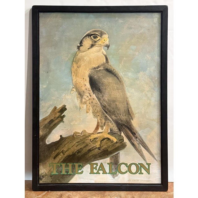 An authentic English pub sign (one-sided) featuring a beautiful painting of a falcon perched on a tree stump, titled The...