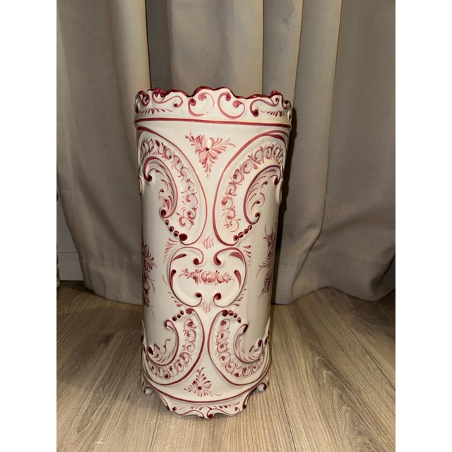 A striking hand-painted ceramic umbrella and walking stick stand crafted in Portugal by the renowned artisans at RCCL...