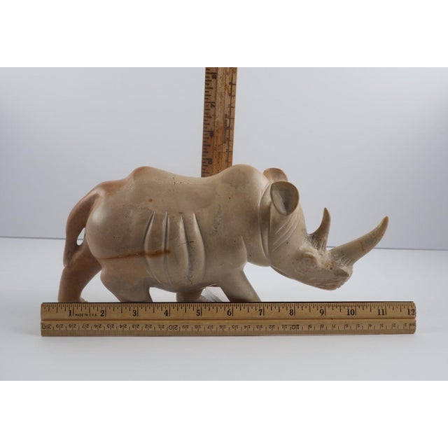Coffee Hand-Carved Stone Rhino Sculpture – Heavy Decorative Animal Figure, Natural Veining For Sale - Image 8 of 8