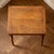 A compact wooden writing desk with a balanced structure and traditional turned leg detail. This is a vintage wooden desk...