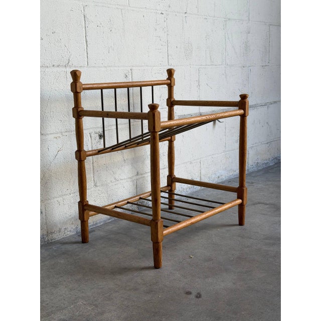 Turned wooden posts support open framing and metal spindle slatted shelves for compact storage. This versatile piece...