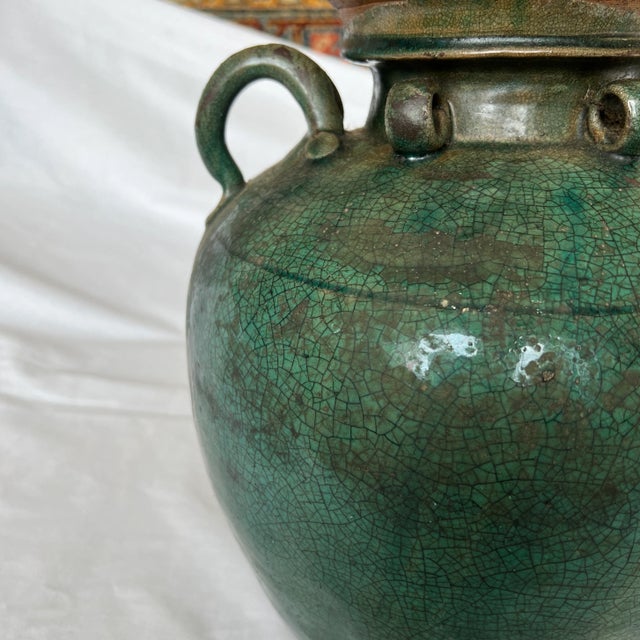 Old hand painted green ceramic vase. Created in Italy.