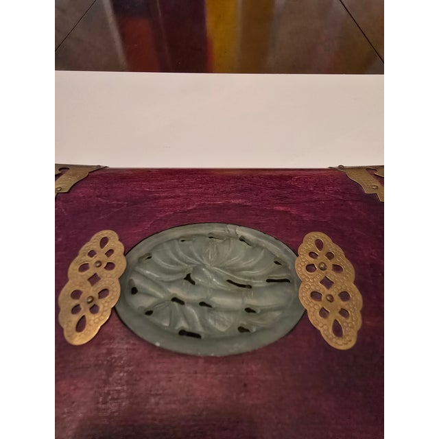 A good mid century era Hollywood Regency glamour chinese music / jewelry box with a hand carved reticulated jade insert (...