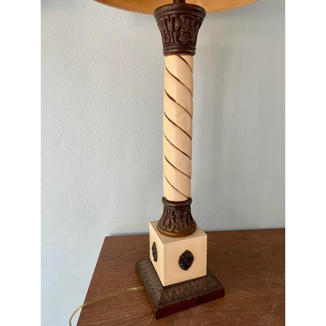 Make a statement with this extra tall mid-century lamp. The lamp is a twisted ivory with a brown detailed top and base....