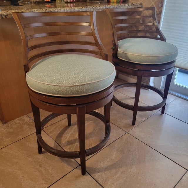 Those swivel stools are part of the ocean club collection by Tommy Bahama home. It features a contemporary design inspired...