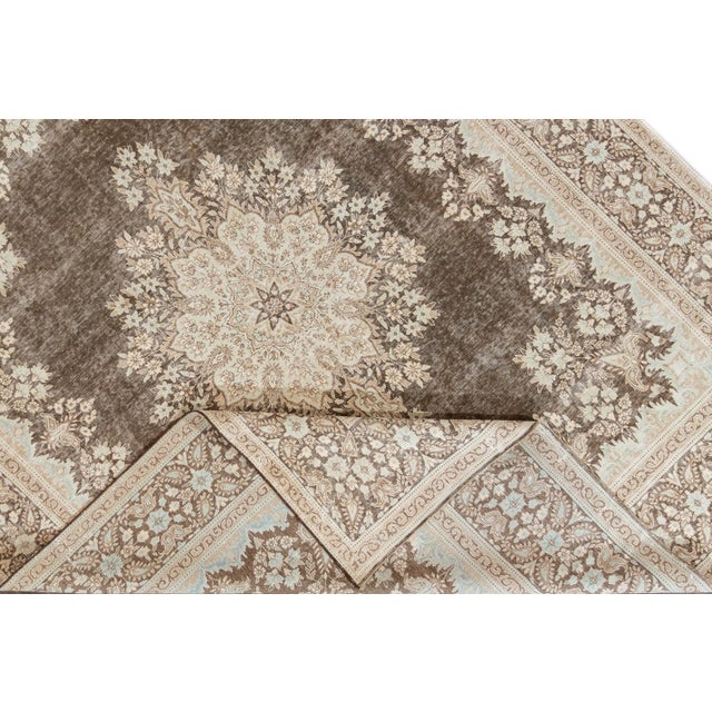 Beautiful hand-knotted wool, vintage medallion rug. This rug has a gray field with an ivory border featuring an all over...