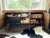 A mid-century inspired walnut credenza by Cisco Brothers. This credenza features two adjustable interior shelves in each...