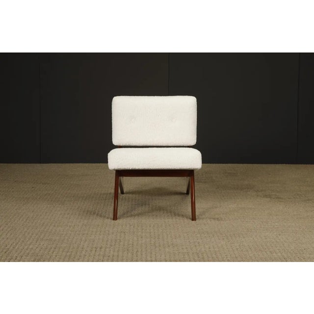 This exceptional sculptural Brazilian Modern lounge chair, newly refinished and reupholstered in luxurious white bouclé,...