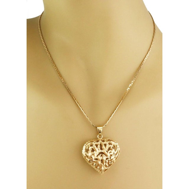 This authentic Filigree Puff Heart 14k Yellow Gold Pendant with Long Chain Necklace is a beautiful vintage estate piece...
