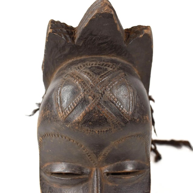 The Mwana Pwo Chokwe mask is a traditional wooden mask crafted by the Chokwe people of Central and Southern Africa, found...