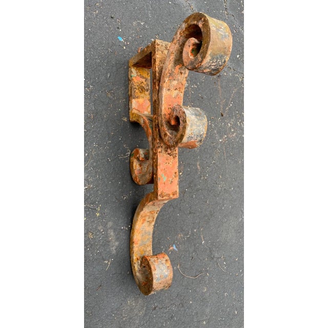 This large antique cast iron corbel bracket is a stunning piece of architectural salvage that would make a great addition...