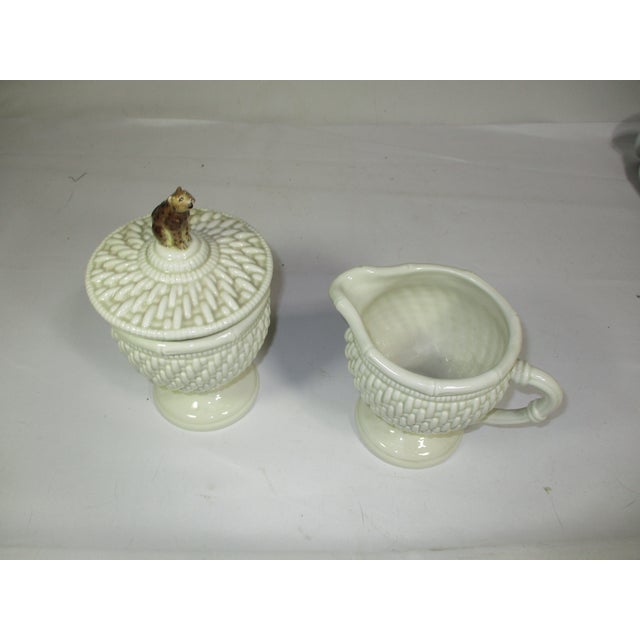 Raymond Waites white porcelain sugar and creamer from his Empire collection. They are footed and decorated with raised...