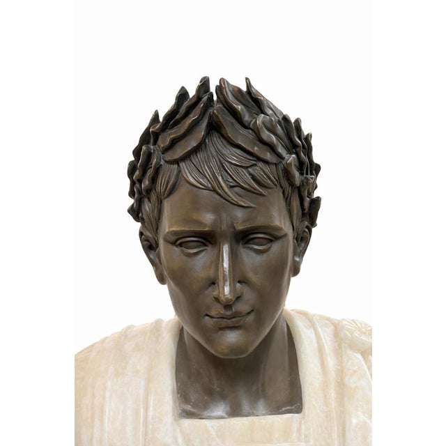 Impressive large-scale bust of a Roman emperor, executed in a striking combination of dark patinated bronze and finely...