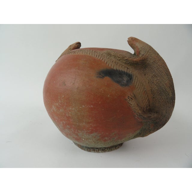 1980s African clay bowl with lizard handles. Measures: 14" diameter with handles; 11" without handles; 11" high.