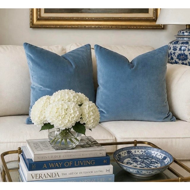 One pair of vintage french blue cotton velvet pillows measuring 21 X 21 inches with down and feather inserts and invisible...