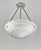 A French art deco pendant chandelier made around 1930 in nickel plated bronze or solid brass holding a bowl in clear...