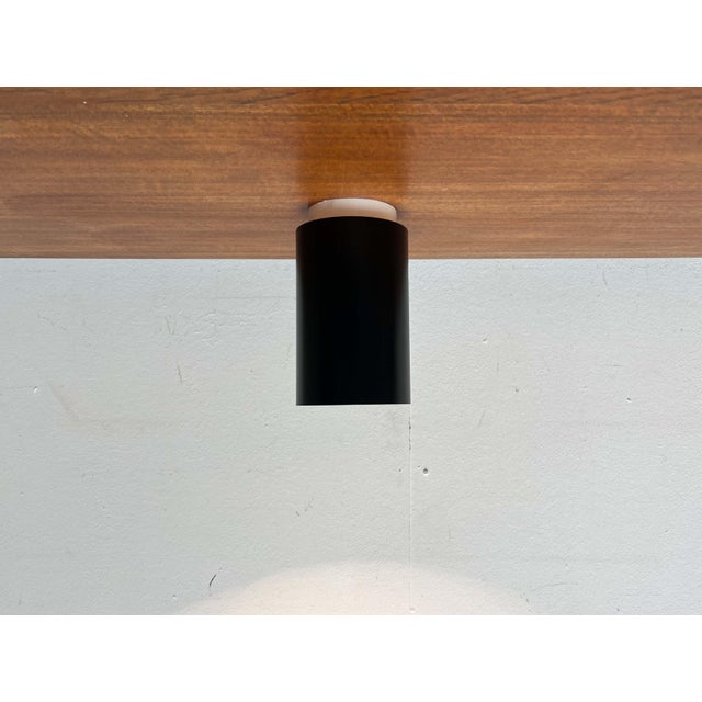 Minimalist ceiling light from Ikea, dating from the 1980s. The light fixture impresses with its clean, geometric design....