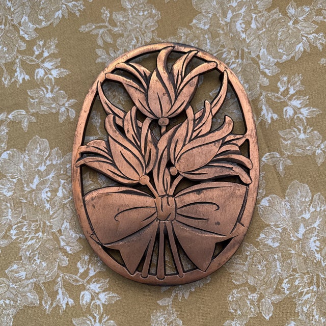Beautiful MCM copper trivet, floral subject matter with a bow, good look on it