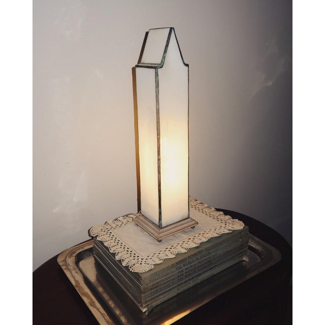 Architectural leaded glass obelisk form table lamp featuring hand assembled opaque marbled glass panels within a leaded...
