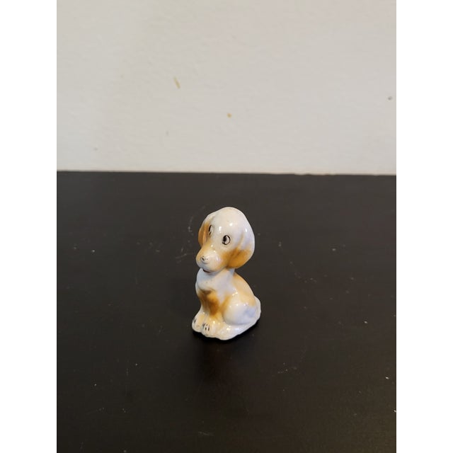 Vintage porcelain dog made in occupied Japan. Great for any dog lovers collection.