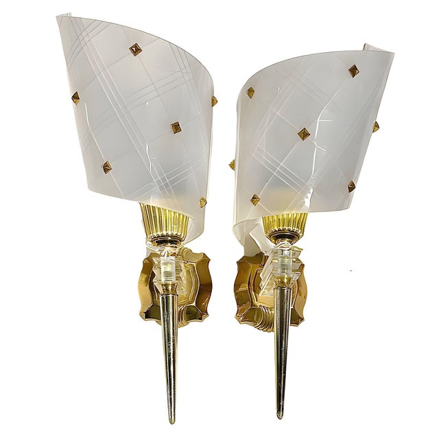 Set of 3 wall lights by Pierre Guariche from the Luminaires lamp company with original sales tags. Crafted with a blend of...