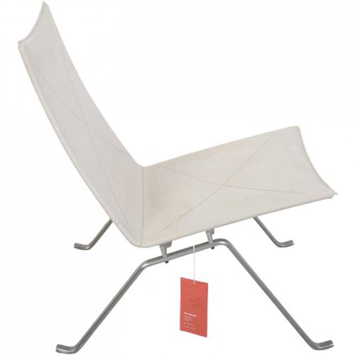 Poul Kjærholm PK22 lounge chair upholstered in canvas fabric, and with a frame of brushed spring steel. The chair is from...