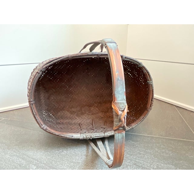 This unique woven basket has been finished with a gray wash that gives it a beautiful and interesting patina.