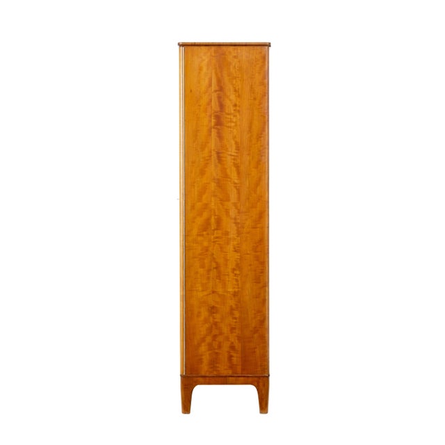 Mid century birch wardrobe by Oscar Nilsson for Nordiska Kompaniet circa 1939. Fitted wardrobe which is an early piece in...