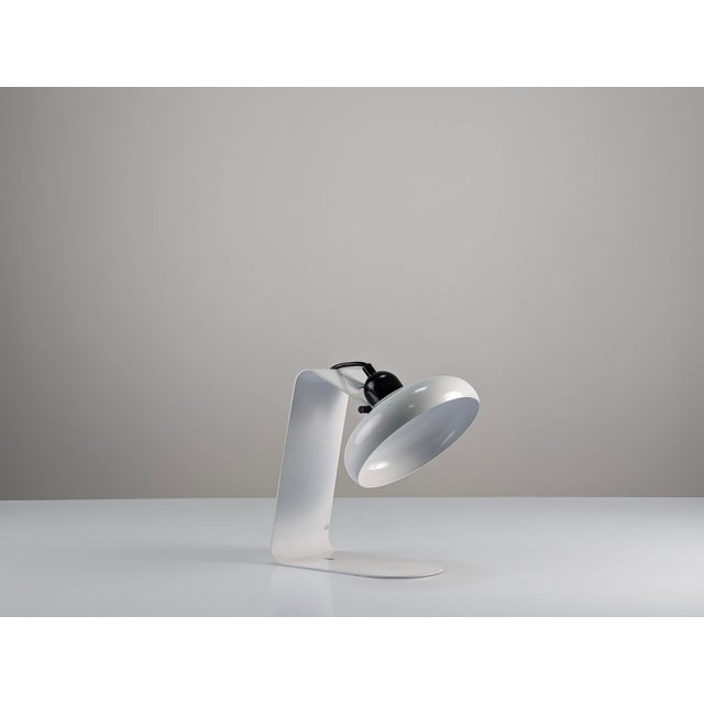 Lamp designed by the prestigious Italian house Stilnovo. This extremely rare model shows a multifunctional design as a...