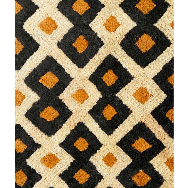 Traditional vintage Kuba grass textile handmade from the indigenous people of the Congo. Bold geometric patterns created...