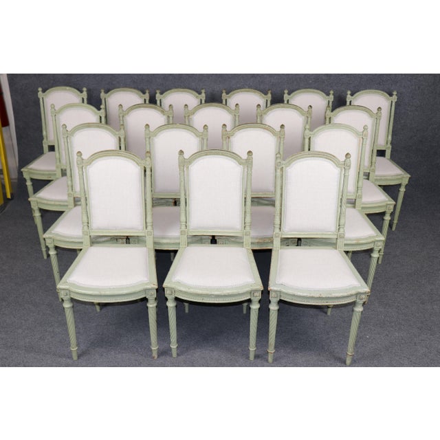 Add glamour and taste to your dining interior with this exceptionally rare set of 18 signed dining chairs by Maison...
