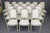 Add glamour and taste to your dining interior with this exceptionally rare set of 18 signed dining chairs by Maison...
