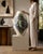 Large-scale studio ceramic vessel combining wheel-thrown construction with a dramatically altered, asymmetrical form. The...