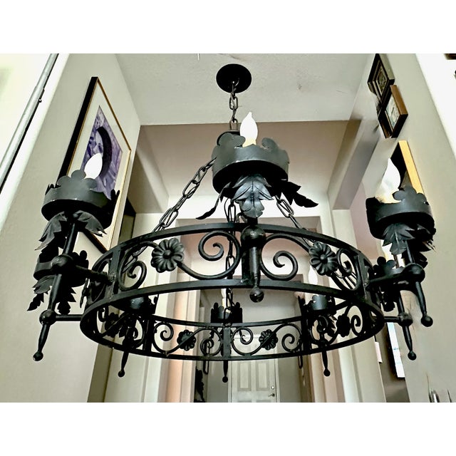 Large Spanish Revival (or Gothic style) black metal forged 8 light chandelier. This fixture is perfect for your entryway,...