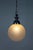 A large, hanging light fixture from the Art Deco era with a trumpeting, chrome shade holder in the iconic style. The...