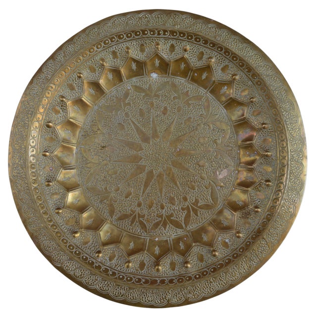 Antique highly crafted, engraved and detailed Moroccan tray. Constructed of solid brass with ornate multi-dimensional...