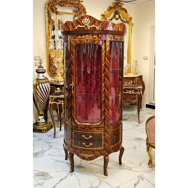 Elevate your interior with this magnificent luxury vitrine cabinet, crafted in the finest European tradition. Featuring a...