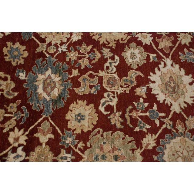 :: Allover covered field in an oversize palmette design motif arranged in rows and columns and nuanced color fills and...