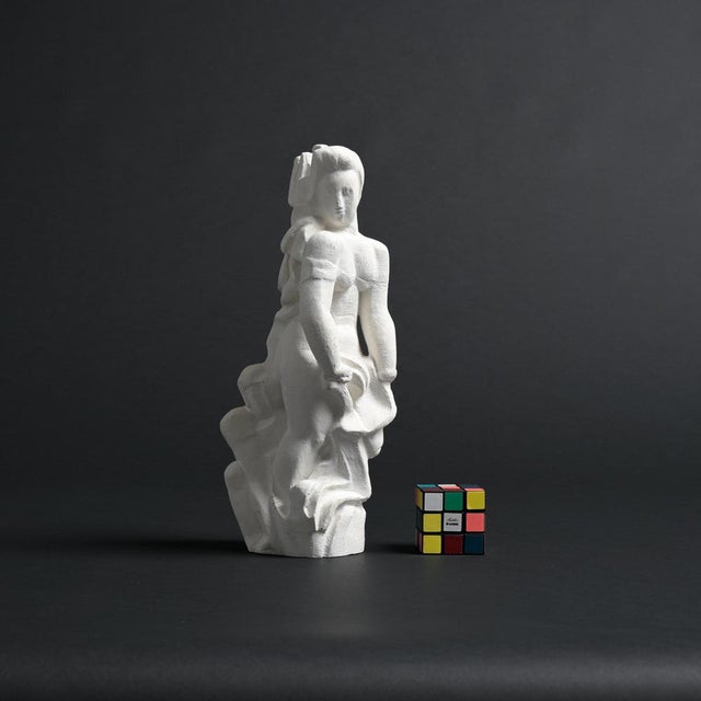 This abstract sculpture in plaster was made by the Belgian artist Jan Keustermans. The sculpture has a rough plaster...