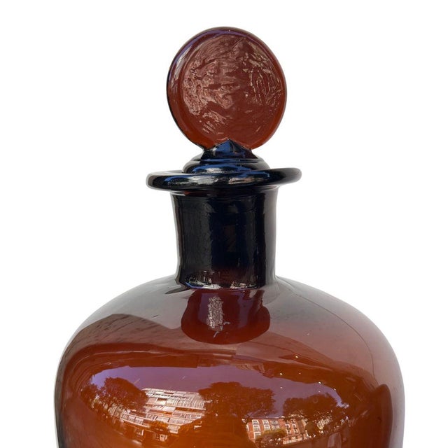 Pair of apothecary jars, amber glass, early 20th century – Spain Type: Apothecary jars Material: Glass Period: Early 20th...