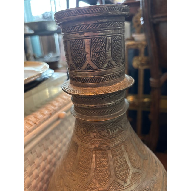Indo-Persian Islamic Style Metal Vase with Intricate Detailing in a Silver Tone .