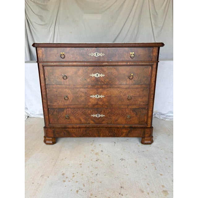 Found in the South of France, this 19th Century French Burled Walnut and Marble Top Chest of Drawers or Commode dates back...