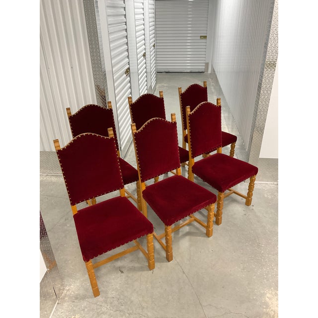 This rare set of six high-back dining chairs, circa 1970, captures the rugged yet refined spirit of Danish "Brutalist"...