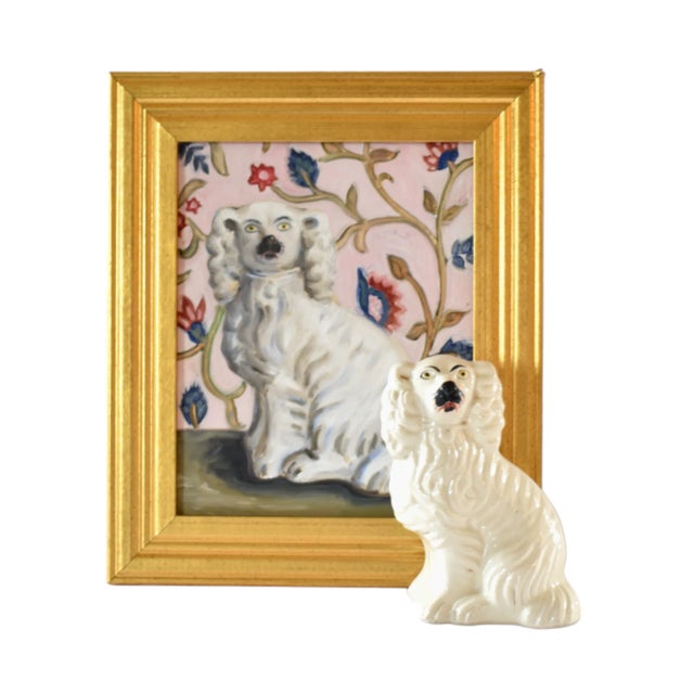 An antique English Staffordshire spaniel dog, white with a black nose, late 19th-century to early 20th-century,...