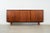 The sideboard was made in the 1970s, Danish production. The structure is covered with teak veneer. The legs are made of...
