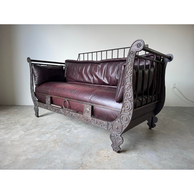 A chocolate leather Ernest Hemingway iron sofa by Thomasville. This " EL TORO - THE BULL" loveseat from the Ernest...