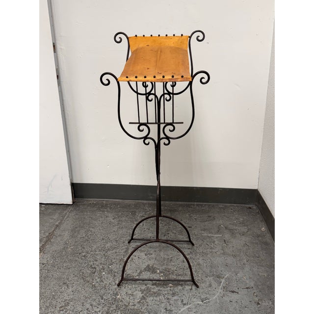 Design Plus Gallery presents an Early 20th Century Wrought Iron Book or Music Stand. The stand has a blackened wrought...